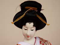 close up of a geisha doll 